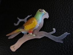 Ginger Bottari, Parrot brooch #1, saw pierced titanium, collected object